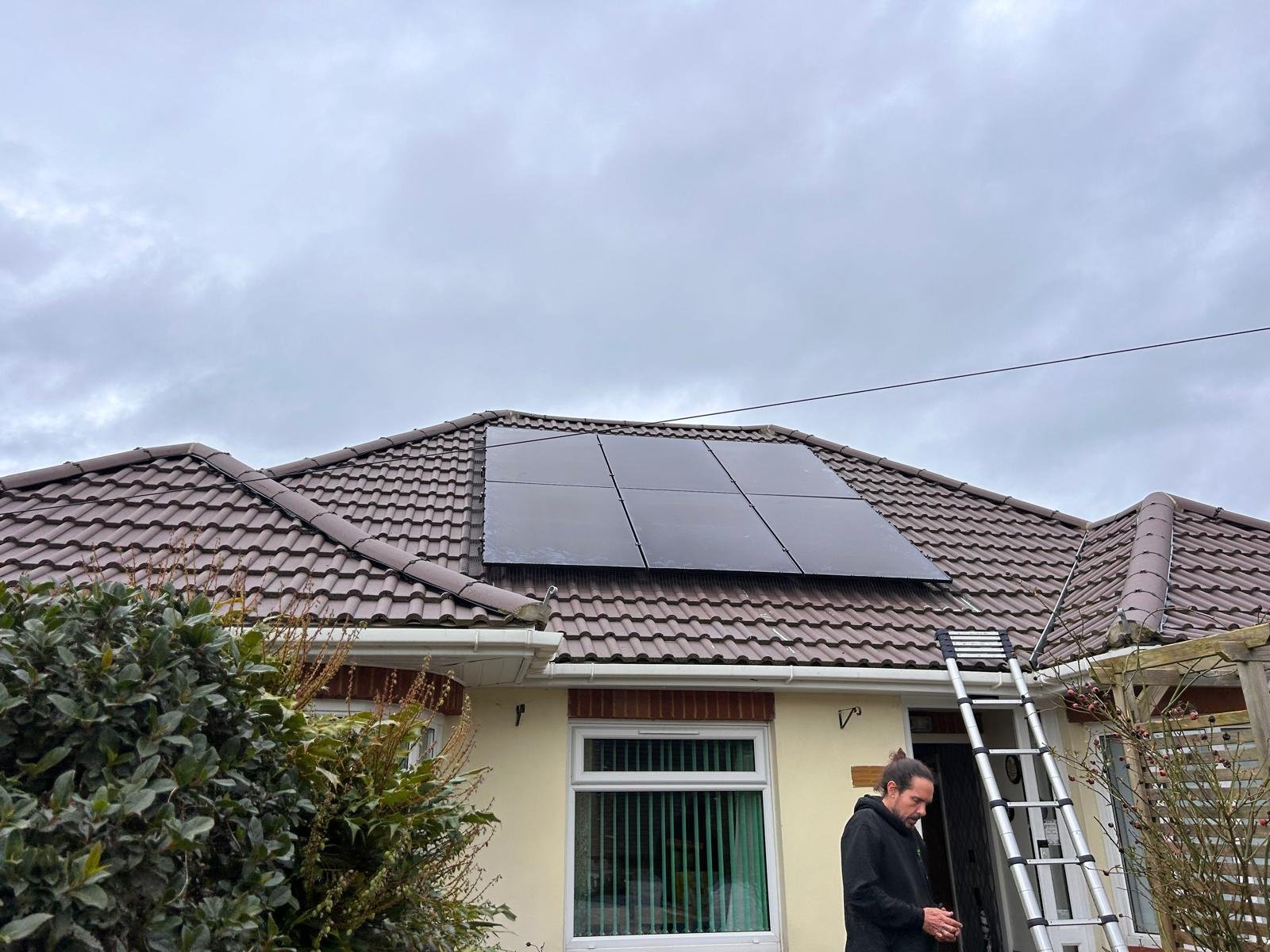 Completed solar installation on a cream rendered house in Winchester