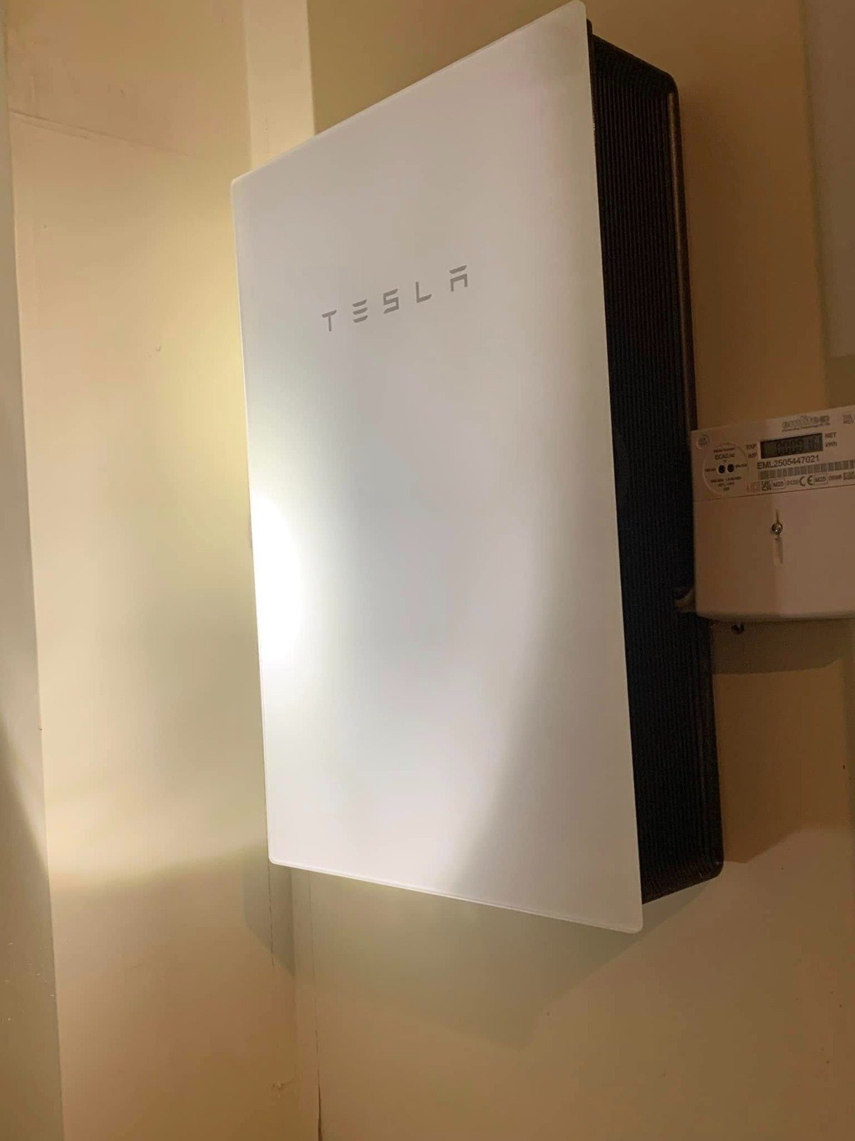 Tesla Powerwall home battery installed on an exterior wall in Winchester