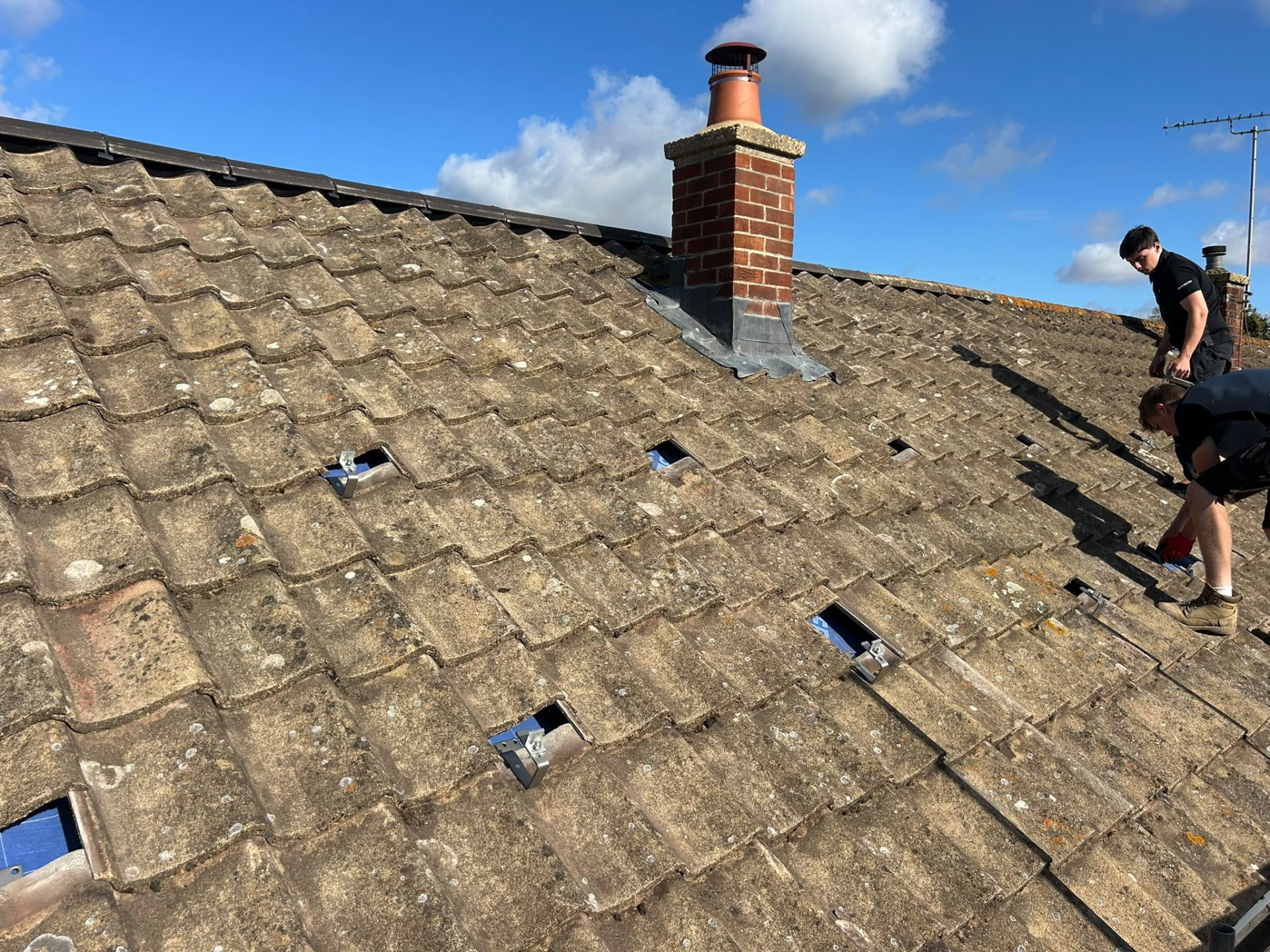 Solar panel roof hooks and tile preparation during installation