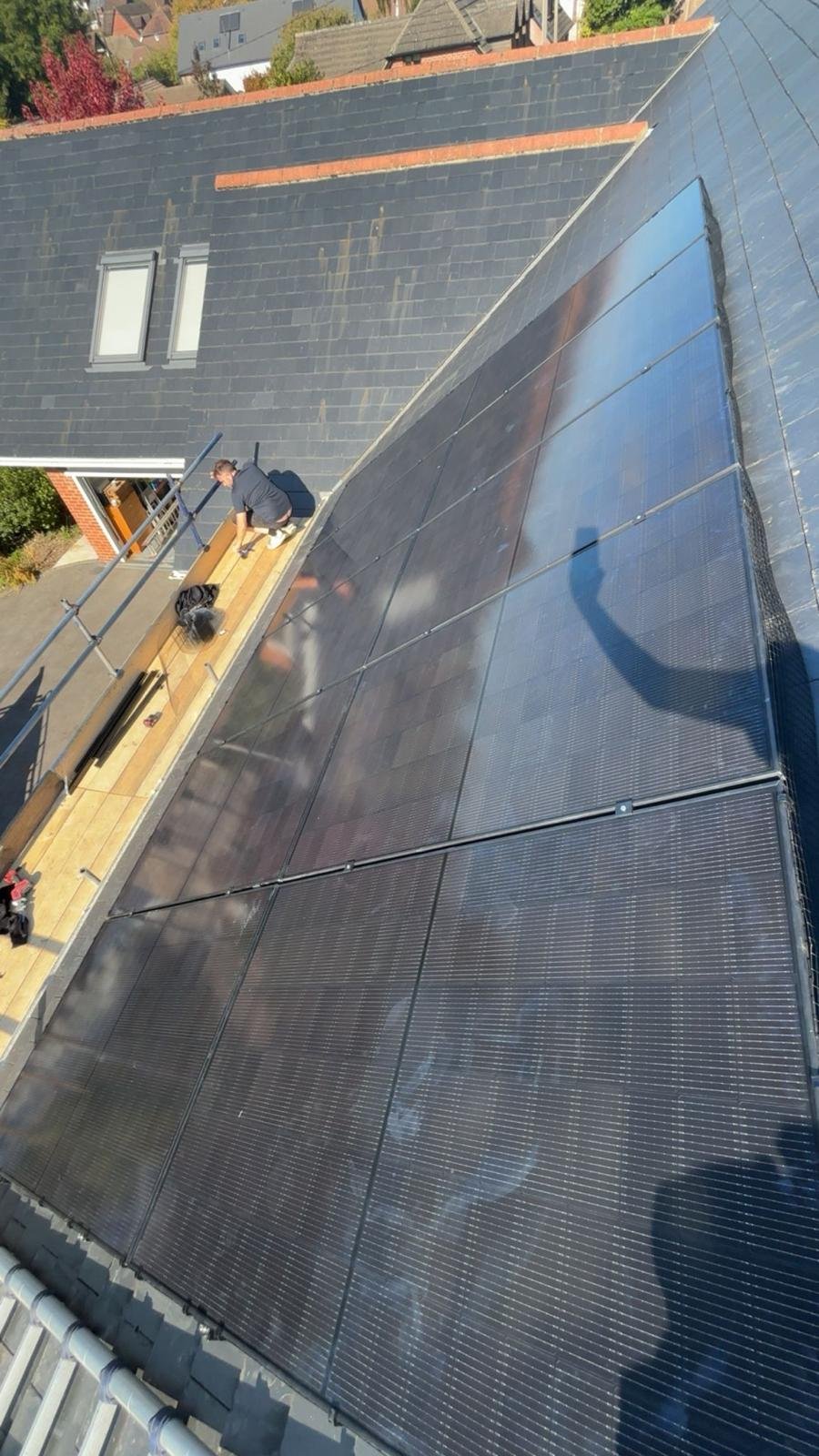 Large rooftop solar PV array with bird mesh protection in Hampshire